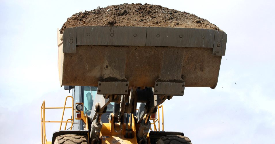 front loader loaded with dirt